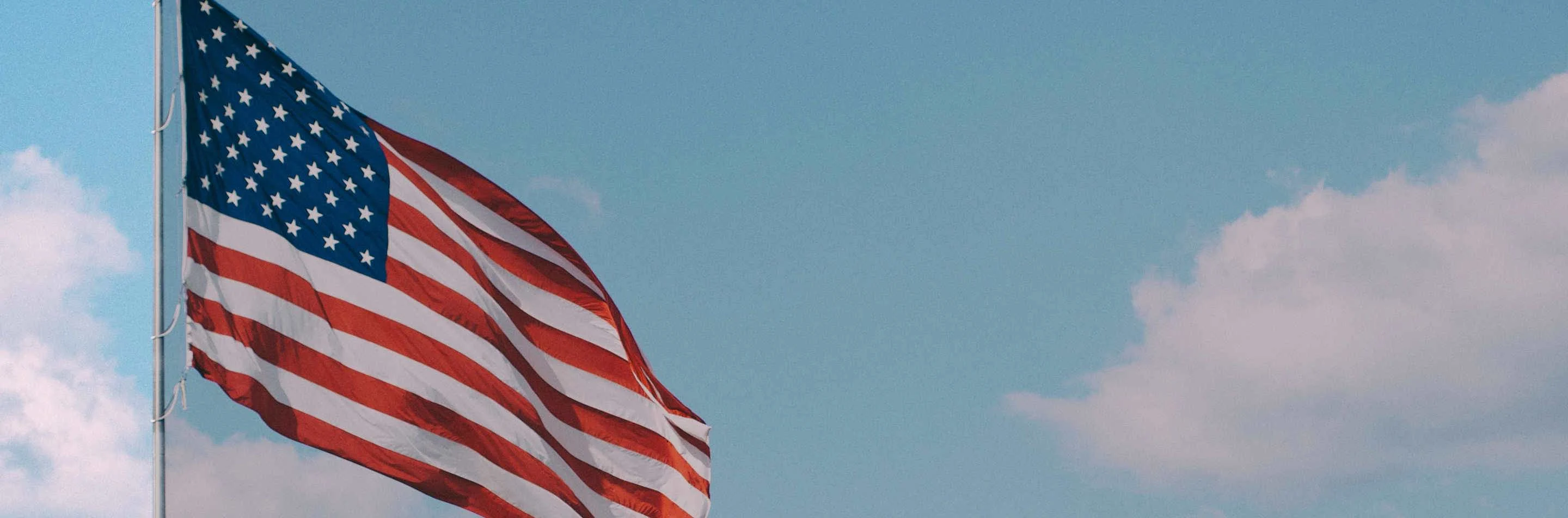 background image of American flag in the sky background