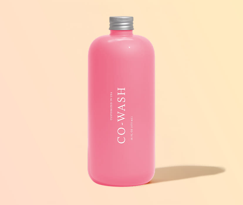 Customized Co-Wash bottle in pink color. 