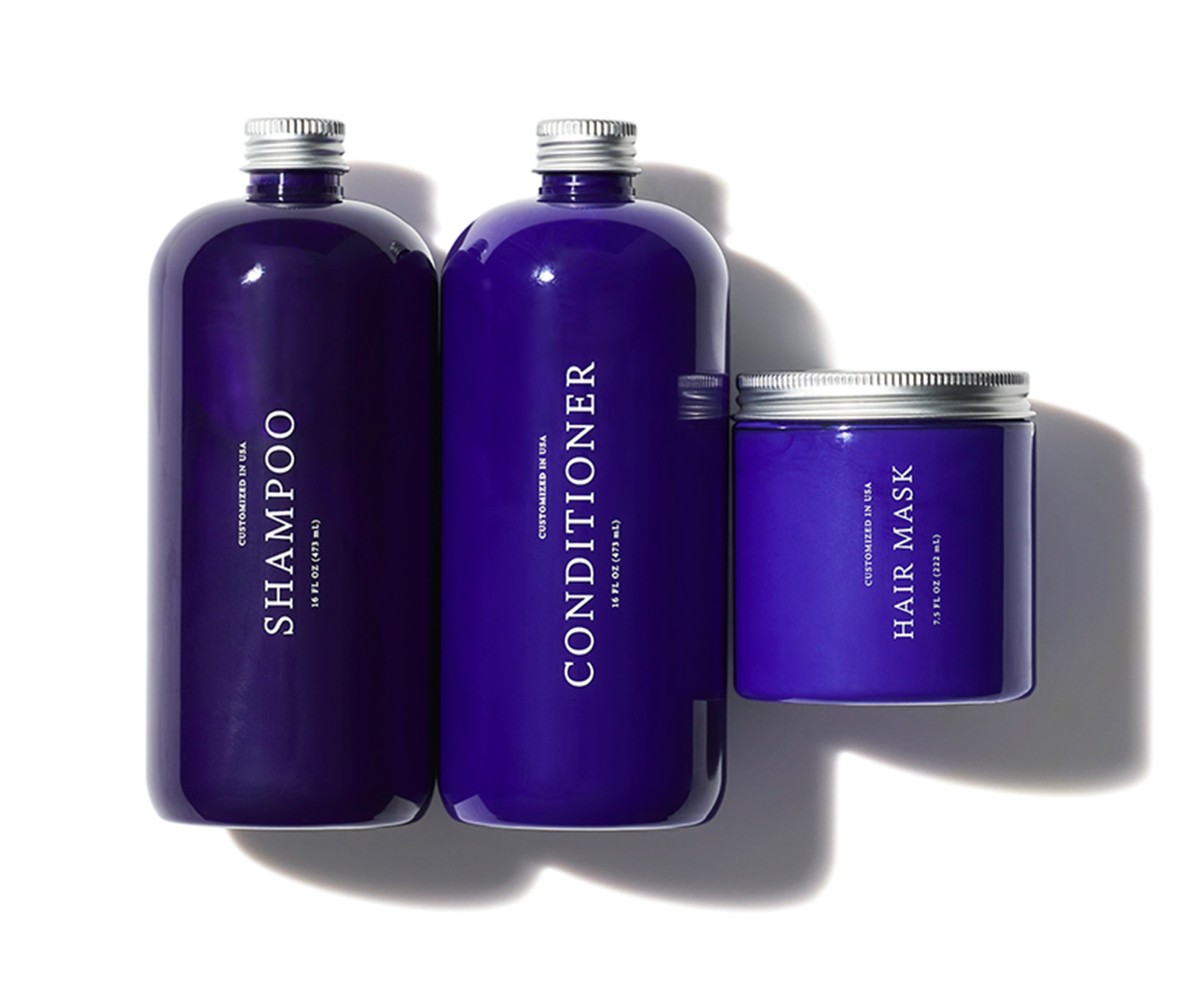 Customized Purple Shampoo, Conditioner and Hair Mask on a white background.