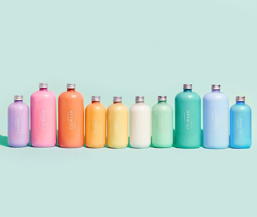 Collection of Custom Co-Wash bottles in a rainbow of colors. 