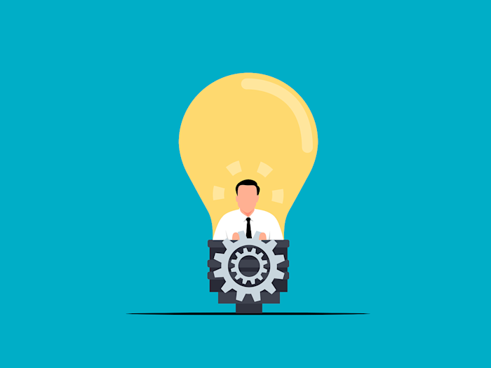 An illustration of a brilliant bulb with a businessman icon