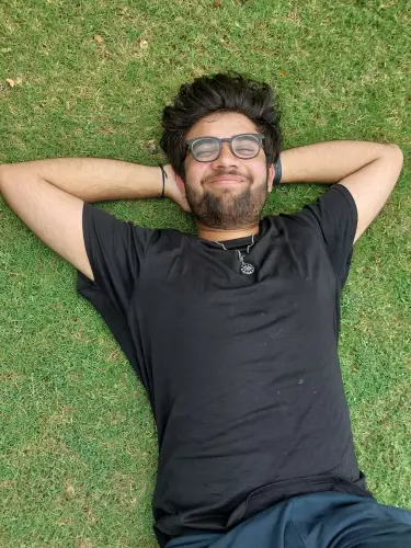 Picture of a person standing in grass in black and white