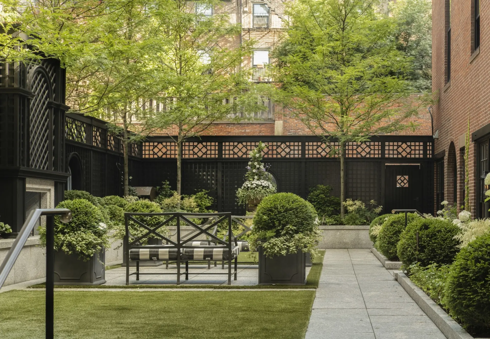 Enclosed courtyard with brown lattice fence