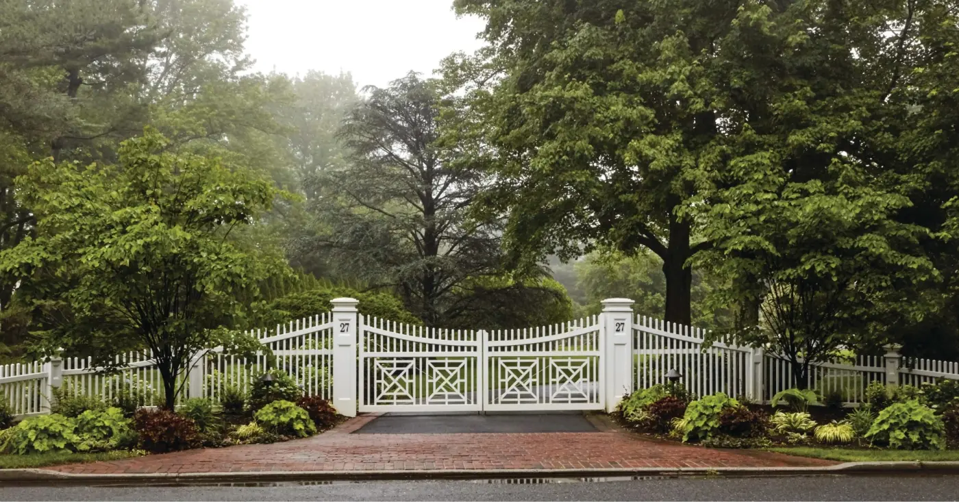 White picket driveway gate