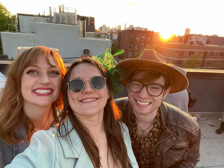 Emily (center) and Brandon (right) on a rooftop. Photo courtesy of Emily.