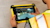 Man in reflective vest using Trimble FieldLink software on tablet in construction site