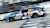 Trimble #17 car driven by Chris Buescher for RFK Racing blurred in motion as it speed around a track.