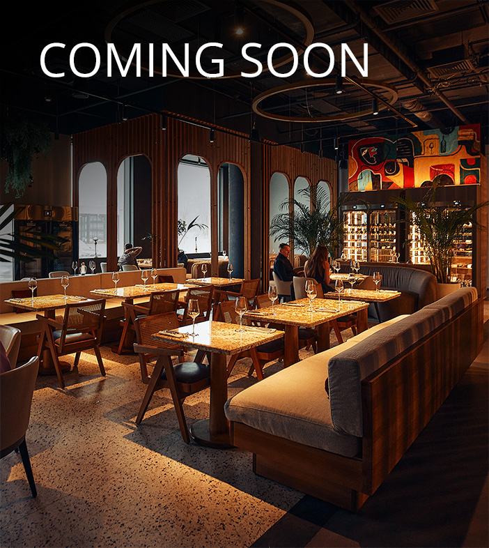 With warm lighting and breath-taking ambiance, the restaurant depicted reminds the viewer that elegance is built into the architecture long before the first plate is served.
