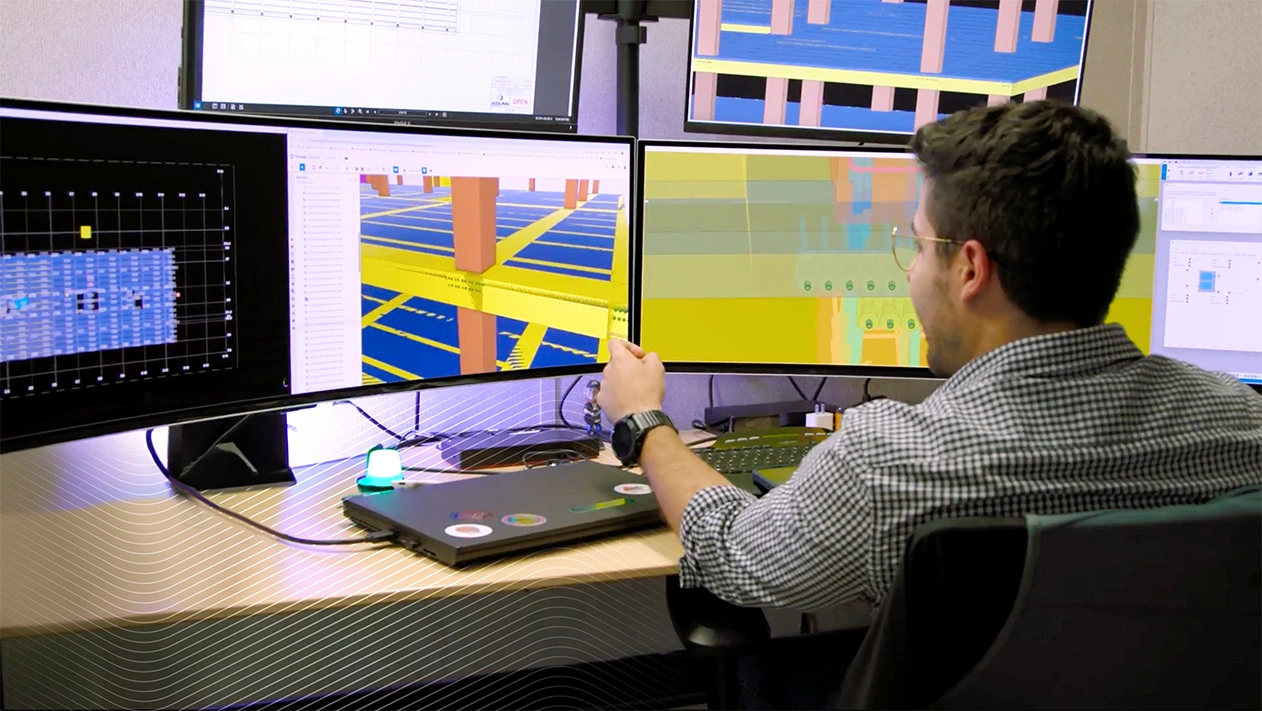 JE Dunn employee reviewing a building model in Tekla, planning a concrete pour to optimize efficiency and sustainability.