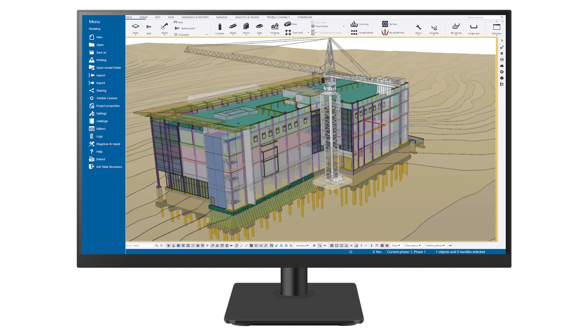 The Tekla Structures interface by Trimble displays a 3D building model and tower crane on a computer monitor.