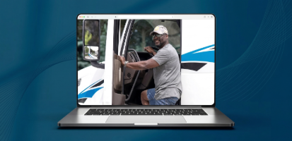 Person smiling at camera getting into truck