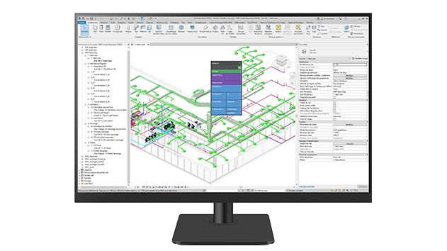 A desktop monitor displays Stabicad for Revit software