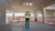Worker on a construction site using ProjectSight 360 Capture with AR overlays showing a calendar, path tracking, and camera menu.