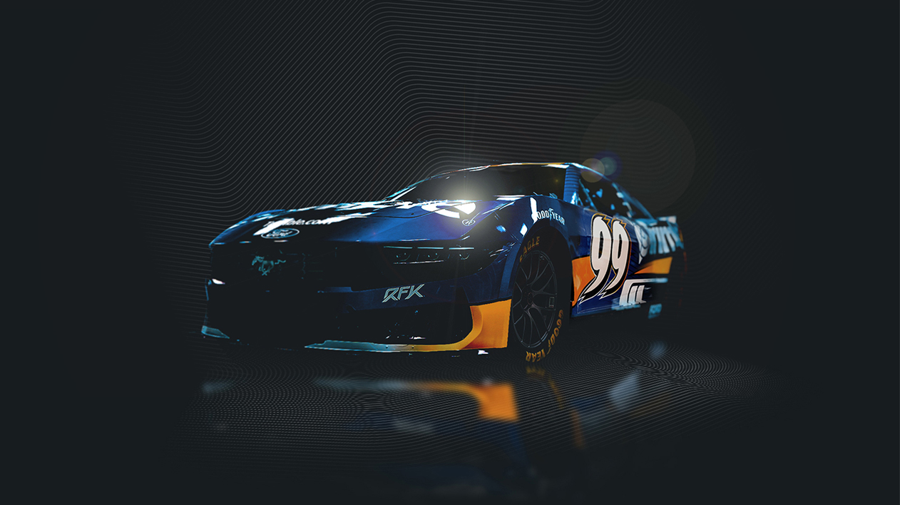 A blue RFK Racing #99 NASCAR Ford Mustang with Trimble branding and yellow accents, shown in a dark studio setting.