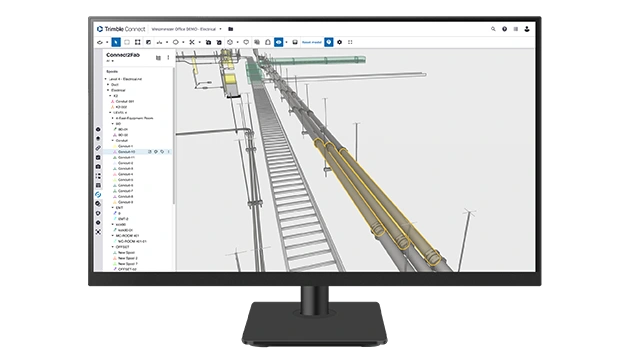 A desktop monitor displays Trimble Connect2Fab software.