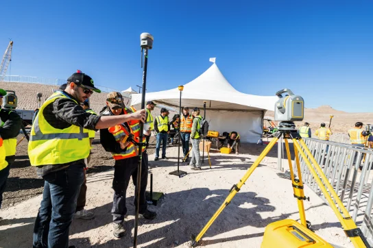 A Trimble team member demonstrates how to use Trimble's surveying and mapping technology at the Offsite expo in Las Vegas