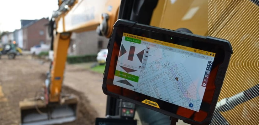 Close-up of a tablet showing Trimble Siteworks site mapping software inside an excavator.