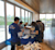 Trimble employees volunteering by loading care package on service day