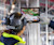 Woman with hard hat using Trimble Connect on a tablet at a job site