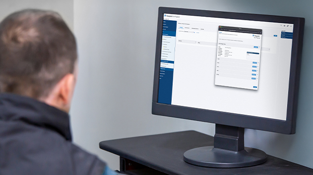User viewing Viewpoint For Projects dashboard on a monitor for construction document management.