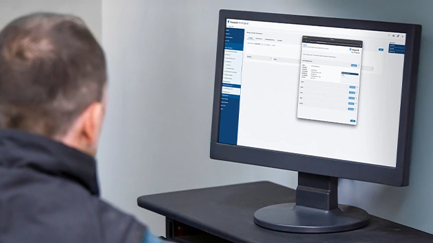 User viewing Viewpoint For Projects dashboard on a monitor for construction document management.