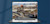 Laptop showing construction workers near light rail with Minnesota skyline in background