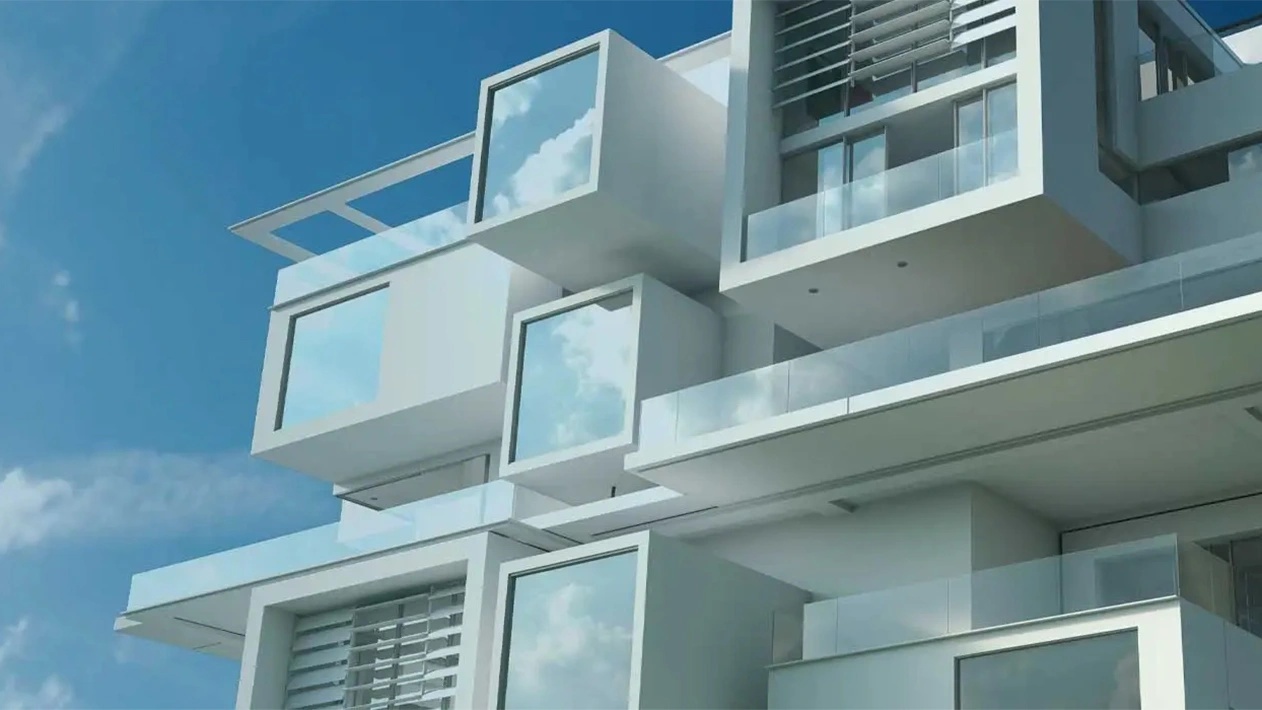 Upward view of modern, modular white building with blue sky