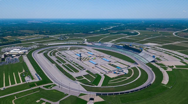 This image is an aerial view of the Kentucky Speedway, a 1.5-mile tri-oval racetrack located in Sparta, Kentucky.