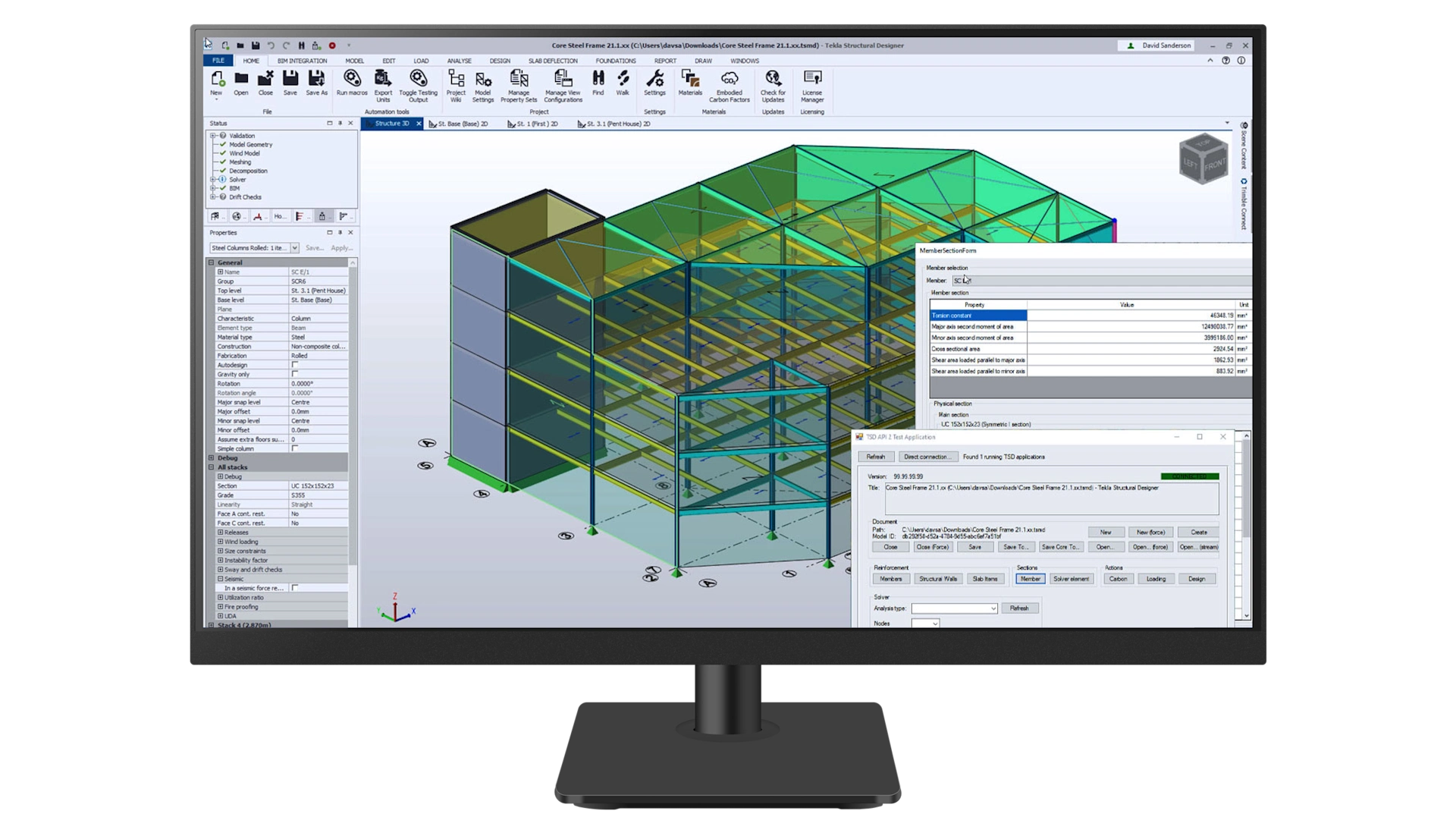 A computer monitor shows a 3D building structural model within Trimble’s Tekla Structural Designer engineering software.