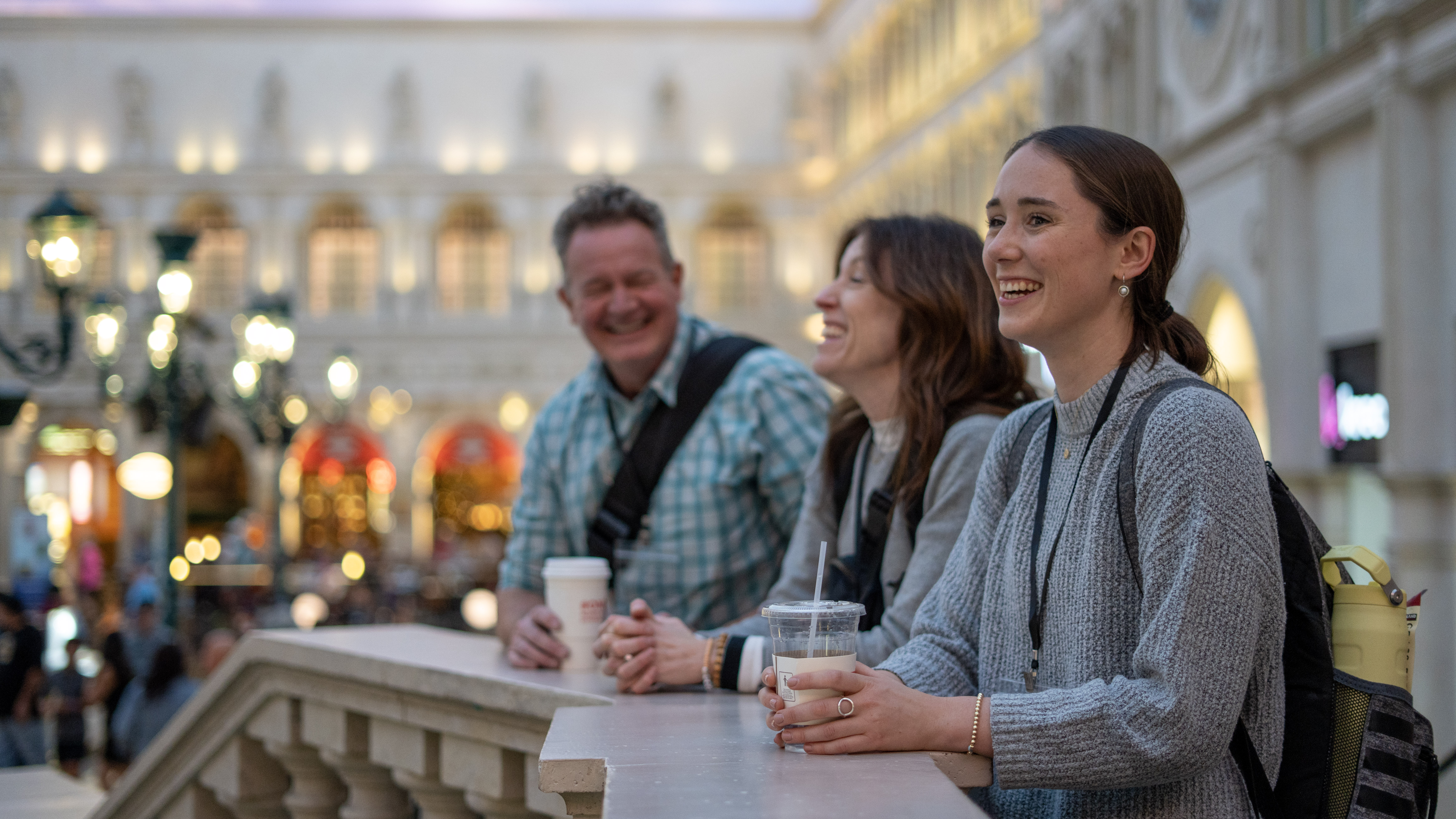 Dimensions attendees laugh while looking out over the canal in St Mark's square of The Venetian Resort