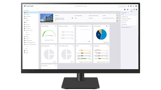 A desktop monitor displays a home view Trimble ProjectSight