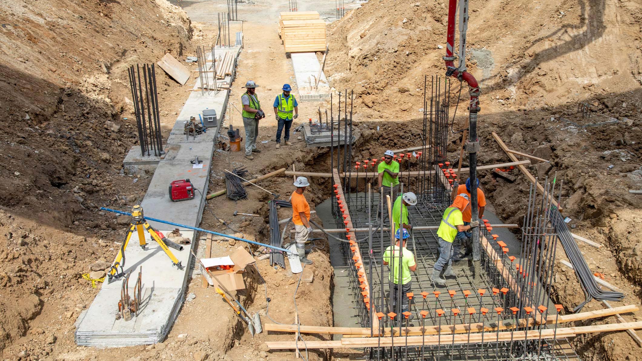 JE Dunn team actively pouring a concrete pad at a construction site in Kansas City.