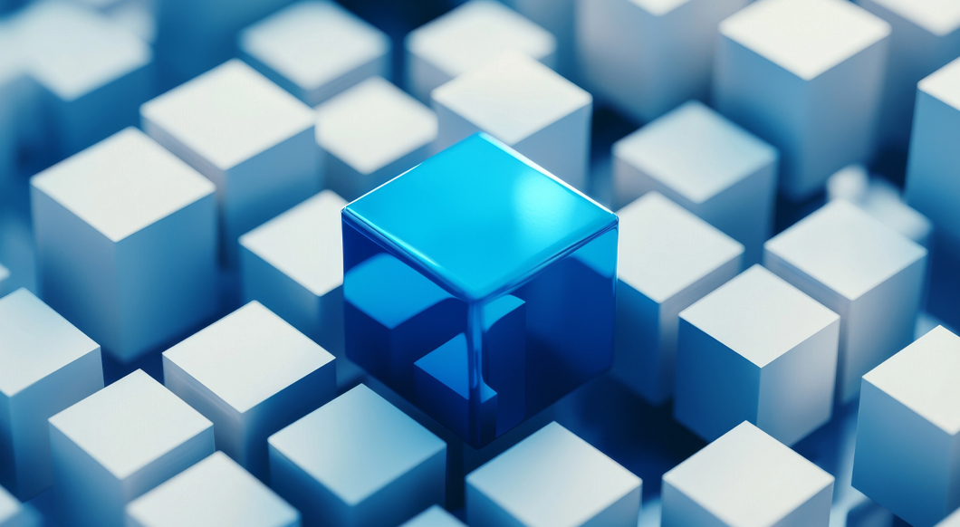 3D render of a single translucent blue cube standing out among a group of opaque white cubes.