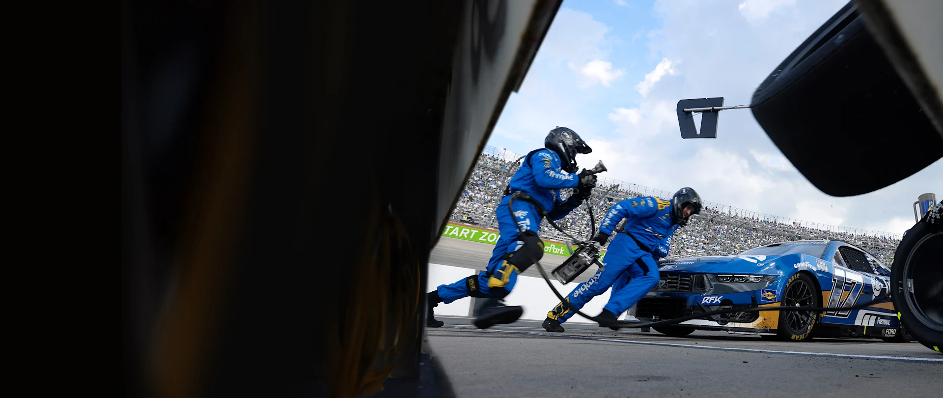 RFK pit crew changing out tires on Trimble branded car image