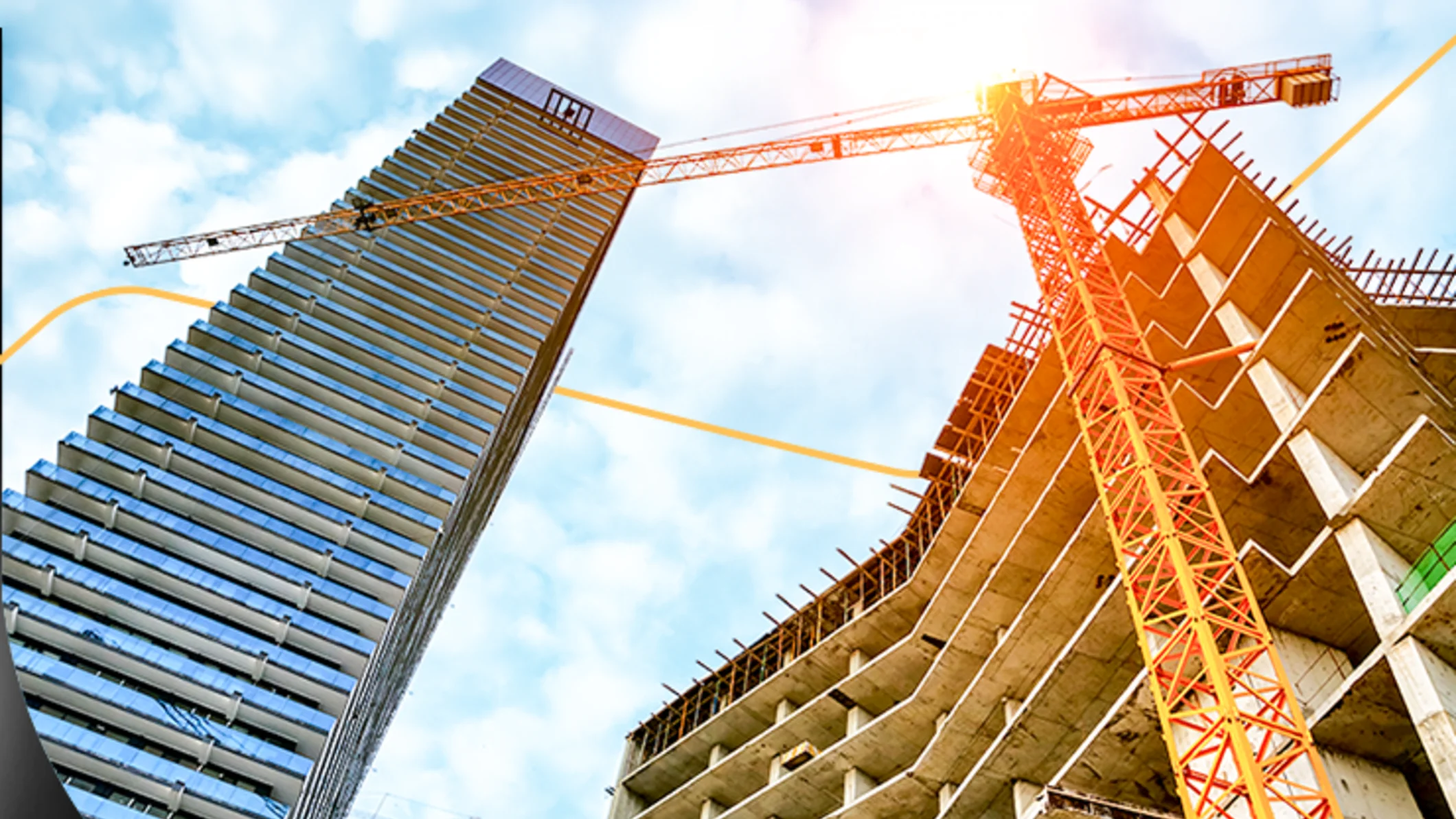 Low-angle shot of an orange construction crane between a glass skyscraper and a building under construction with orange graphic line overlays.