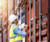 Man with reflective vest and hard hat on tablet inspecting a shipping container