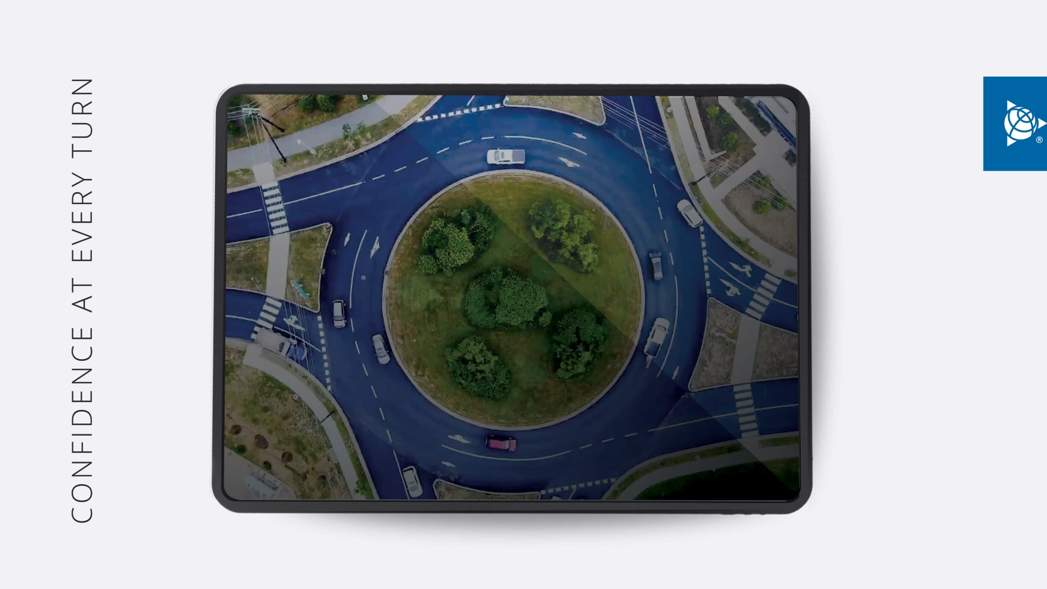 Aerial view of cars navigating a roundabout, with the text "CONFIDENCE AT EVERY TURN" and the Trimble logo.