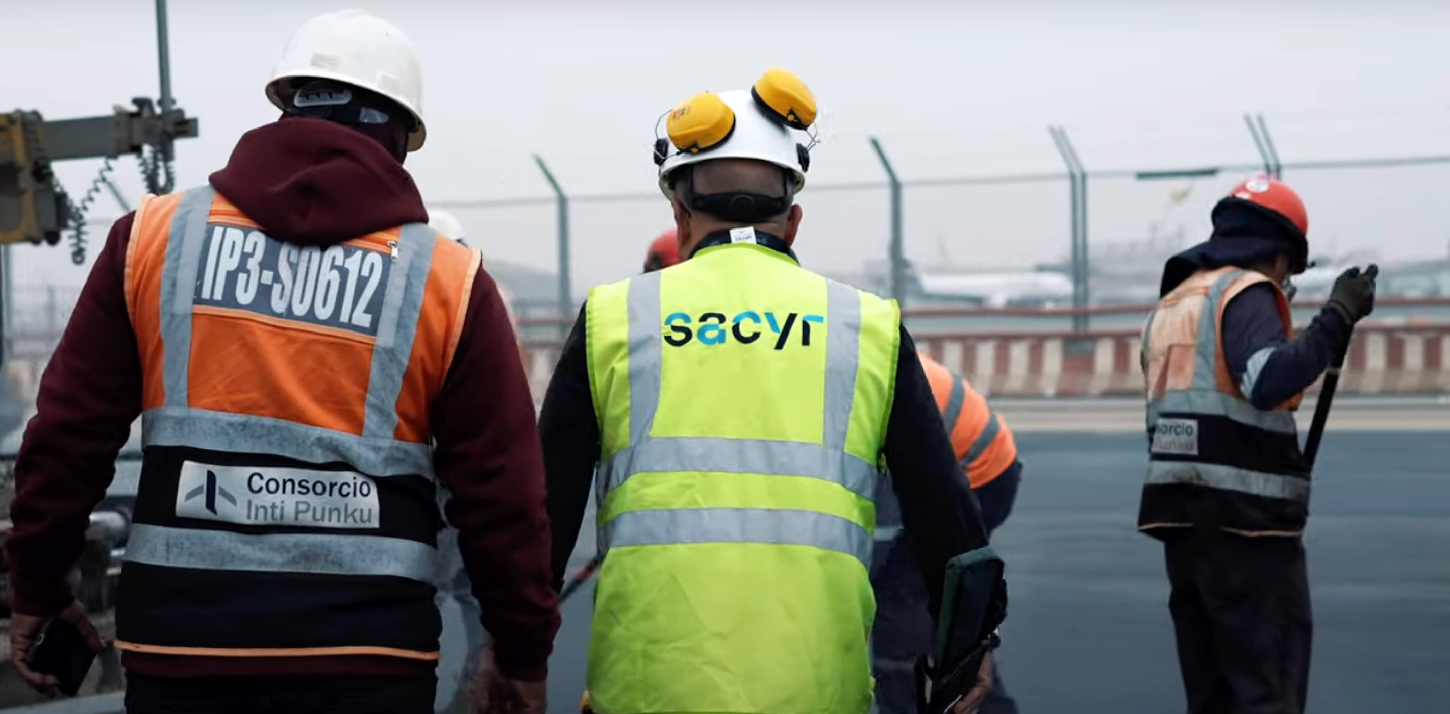 Field workers paving a runway
