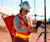 Woman using Trimble Geospatial equipment on construction site