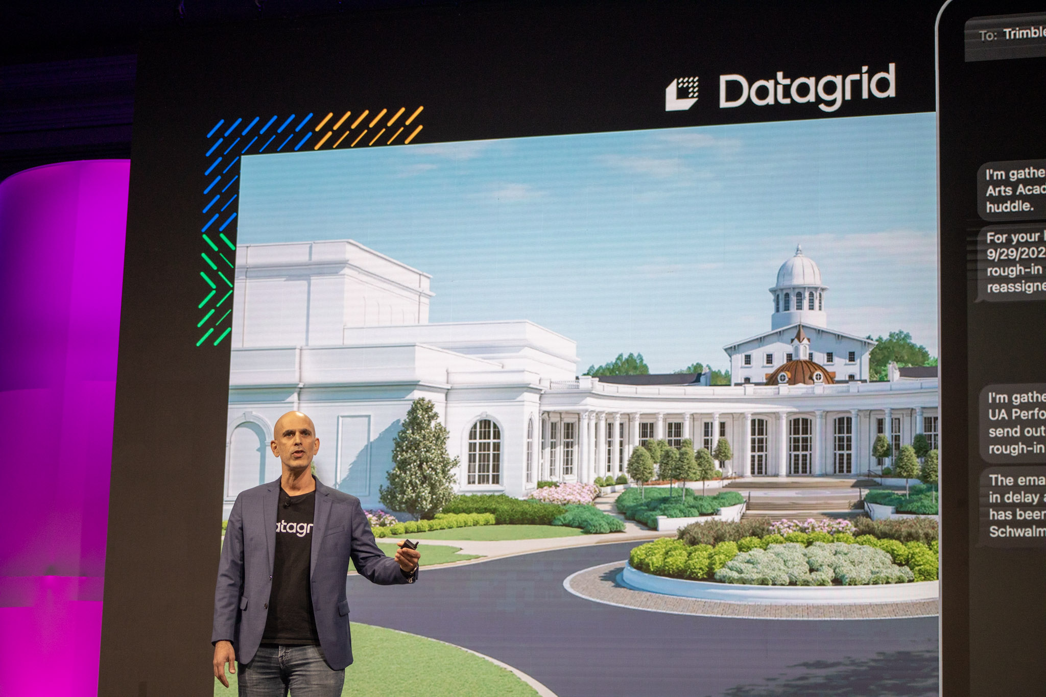 Thiago da Costa, CEO of Datagrid, presents at Trimble Dimensions. The screen shows a 3D building rendering and the Datagrid logo.