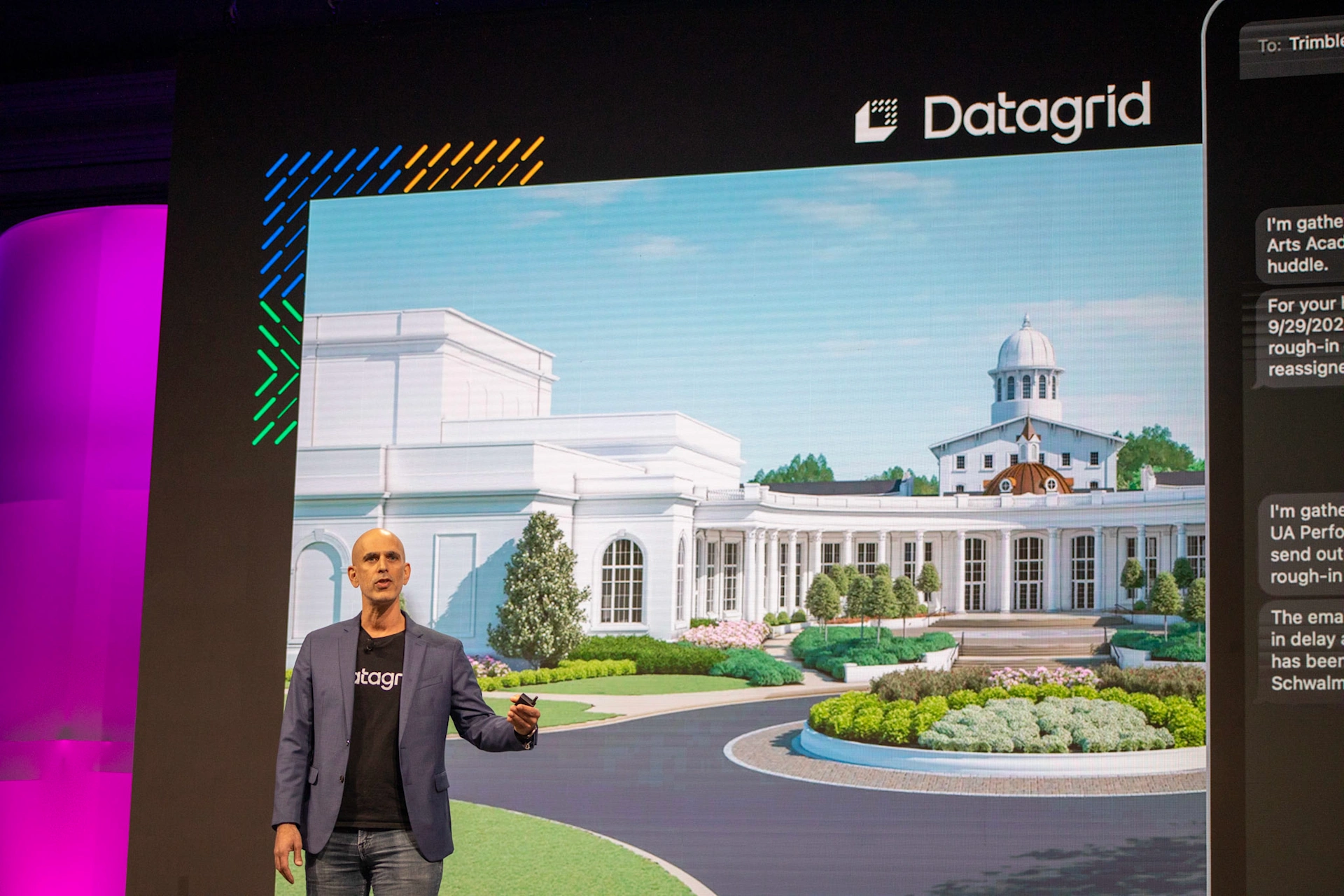 Thiago da Costa, CEO of Datagrid, presents at Trimble Dimensions. The screen shows a 3D building rendering and the Datagrid logo.