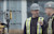 Two construction workers with a robotic total station