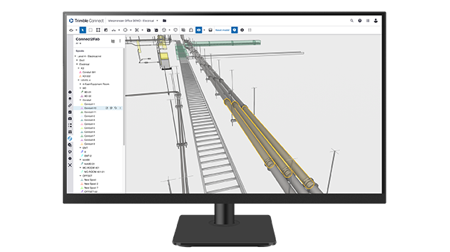 A desktop monitor displays Trimble Connect2Fab software.