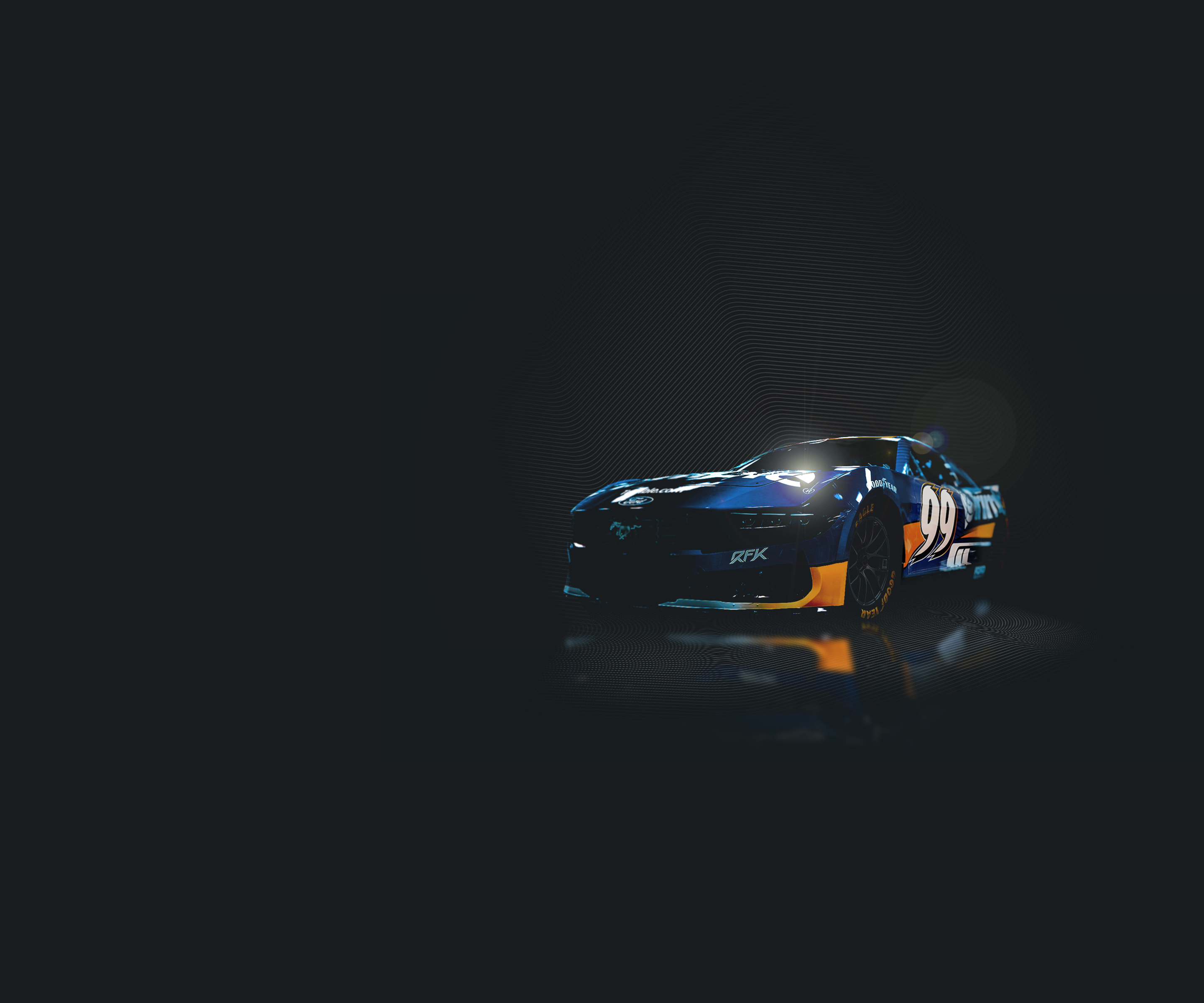 A blue RFK Racing #99 NASCAR Ford Mustang with Trimble branding and yellow accents, shown in a dark studio setting.