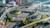 An aerial shot captures a massive, complex highway interchange and overpass system in a modern city on a sunny day.