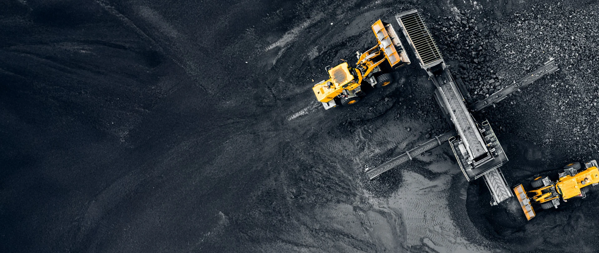 Aerial view of heavy machinery working in a coal mine