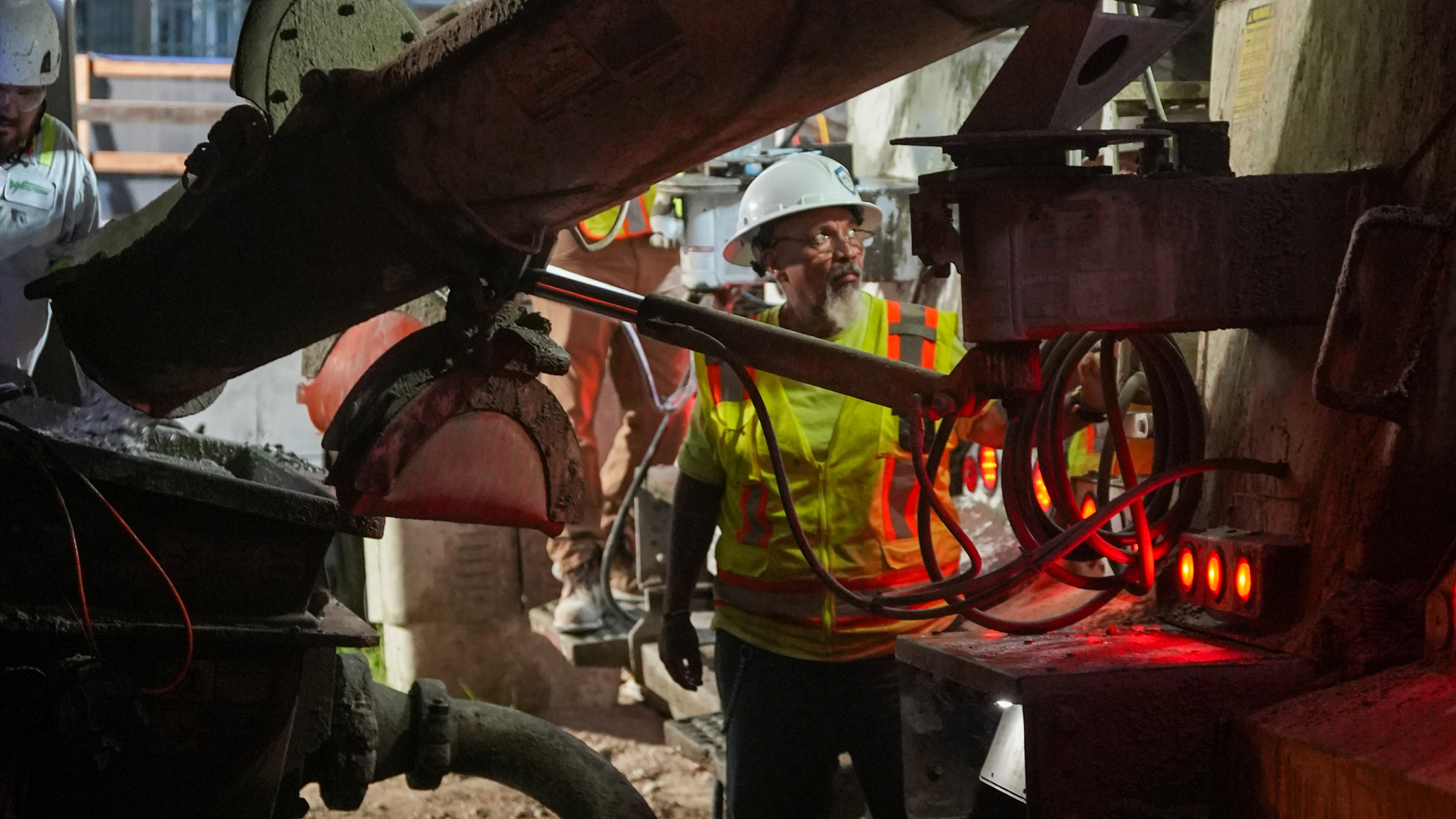 JE Dunn team member inspecting a concrete truck before an early morning pour