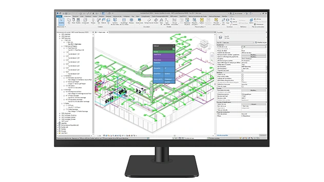 A desktop monitor displays Stabicad for Revit software