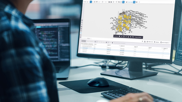 Person using Trimble Connect on a desktop to view a 3D MEP model and corresponding material data table.
