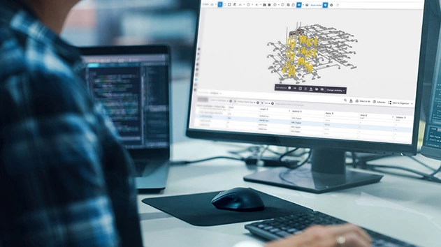 Person using Trimble Connect on a desktop to view a 3D MEP model and corresponding material data table.